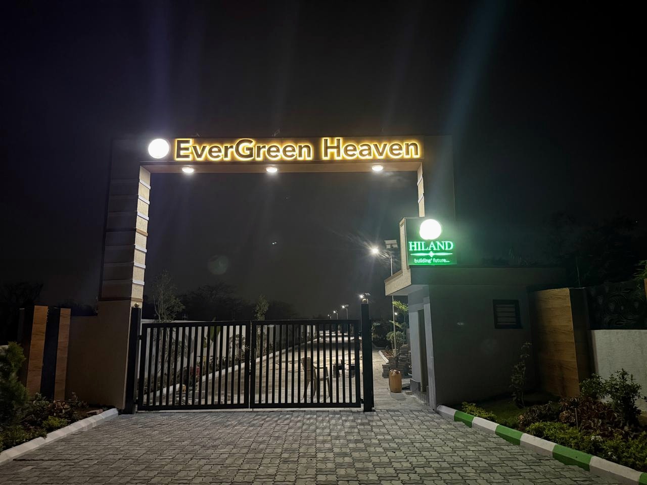 Evergreen Heaven entrance gate at night